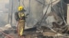 Handout picture released by Rio Grande do Sul Fire Department showing firefighters working on the site of a plane crash in Gramado, Rio Grande do Sul, Brazil, Dec. 22, 2024.