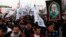 Hundreds rally on the second anniversary of the assassination of Iranian Gen. Qassim Soleimani, chanting anti-American slogans in the streets of Baghdad, Jan. 1, 2022.