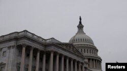 FILE - Morning breaks over the U.S. Capitol dome on the first day of the new Congress, in Washington on Jan. 03, 2023.