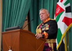 FILE - Jordan's King Abdullah II gives a speech during the inauguration of the 19th Parliament's non-ordinary session, in Amman, Dec. 10, 2020, in this photo released by the Royal Hashemite Court.