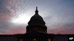 The U.S. Capitol is seen at sunset, Jan. 5, 2022, in Washington. Thursday marks the first anniversary of the Capitol insurrection, a violent attack that has fundamentally changed Congress and prompted widespread concerns about the future of American democracy.