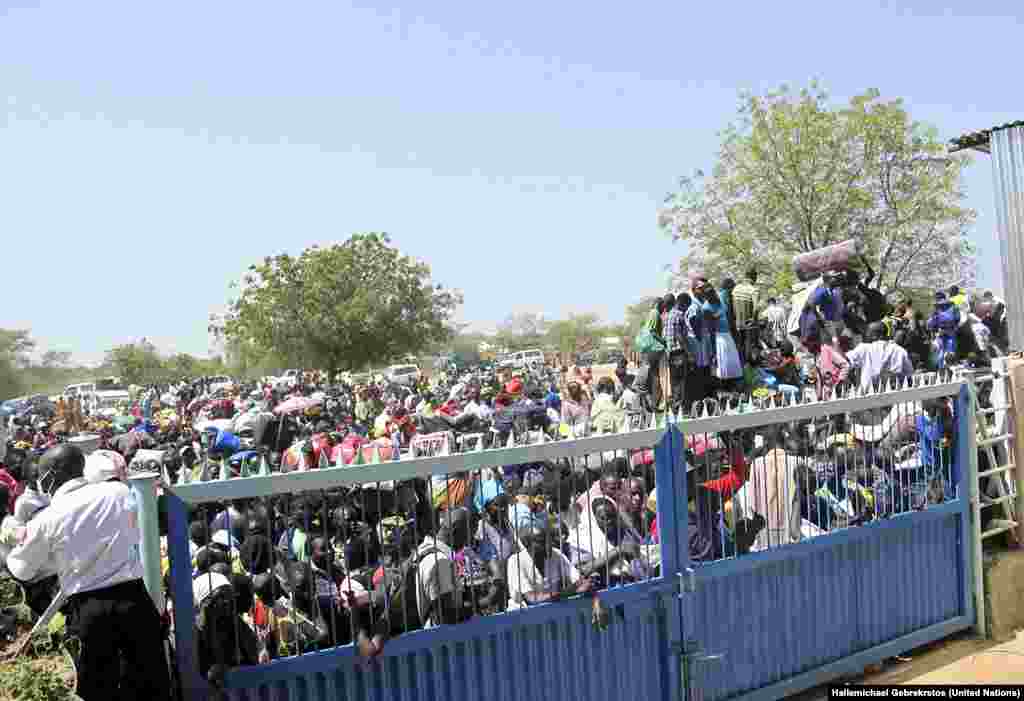 Civilians crush up against the gates of the UNMISS compound in Bor, Jonglei state, days after South Sudan erupted in violence in December 2013. 