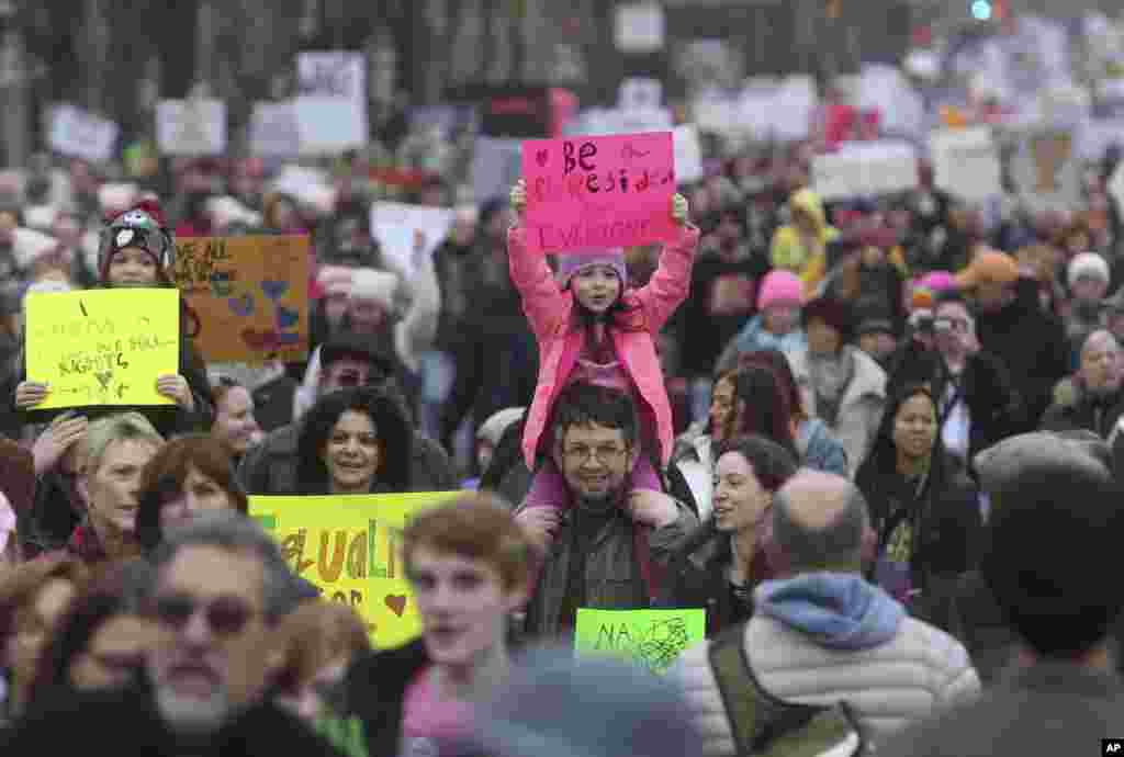 A young girl holds a protest sign as she participates in a Women&#39;s March Saturday Jan. 21, 2017 in Philadelphia. The march is being held in solidarity with similar events taking place in Washington and around the nation.(AP Photo/Jacqueline Larma)