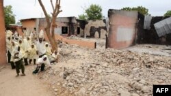 School pupils play in Maiduguri Experimental School, a private nursery, primary and secondary school burnt by the Islamist group Boko Haram to keep children away from school in Maiduguri, northeastern Nigeria, May 12, 2012. 