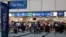 Air passengers heading to their departure gates enter TSA precheck before going through security screening at Orlando International Airport, June 21, 2018, in Orlando, Fla. The TSA is considering dropping security screening at smaller airports to concentrate on larger ones.