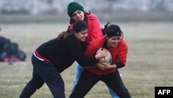 FILE - In this photograph taken on Jan. 18, 2017, Pakistani rugby players take part in a practice session in Lahore. 