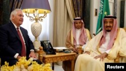 U.S. Secretary of State Rex Tillerson and Saudi King Salman speak before their meeting in Riyadh, Saudi Arabia, Oct. 22, 2017.