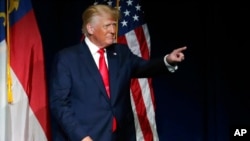 FILE - Former President Donald Trump acknowledges the crowd as he speaks at the North Carolina Republican Convention, June 5, 2021, in Greenville.