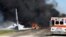 Flames and smoke rise from an Air National Guard C-130 cargo plane after it crashed near Savannah, Ga., May 2, 2018.