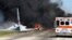 Flames and smoke rise from an Air National Guard C-130 cargo plane after it crashed near Savannah, Ga., May 2, 2018.