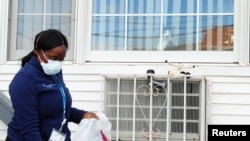 Home care nurse Flora Ajayi departs a home after visiting a client during the ongoing coronavirus disease (COVID-19) outbreak, in the Queens borough of New York City, April 22, 2020. 