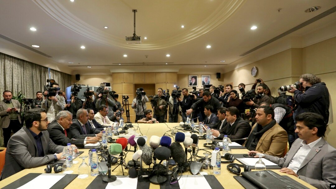 The Houthi rebel delegation, right, and delegates of the internationally recognized Yemeni government hold talks on a stalled prisoner exchange, in Amman, Jordan, Feb. 5, 2019.