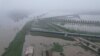 This recent undated photo released by North Korea's official Korean Central News Agency (KCNA) via KNS on July 31, 2024 shows an aerial view of flooding after record-breaking heavy rains near the city of Sinuiju in North Pyongan province.