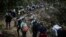 FILE - Migrants walk across the Darien Gap from Colombia to Panama in hopes of reaching the United States, on May 9, 2023.