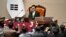 South Korea's ruling People Power Party lawmakers, bottom, argue to National Assembly Speaker Woo Won-shik during the plenary session for the impeachment vote of acting president Han Duck-soo at the National Assembly in Seoul on Dec. 27, 2024.