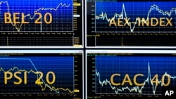 Screens show indexes at the Euronext headquarters in the business district la Defense, outside Paris, Tuesday, Jan. 10, 2017. 