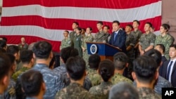 FILE - South Korean President Yoon Suk Yeol gives remarks aboard the aircraft carrier USS Theodore Roosevelt in Busan, South Korea, June 25, 2024, as the newly inaugurated Freedom Edge exercise was wrapping up in the East China Sea. (U.S. Navy via AP)