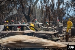 This handout image courtesy of the U.S. Army shows combined Joint Task Force 50 (CJTF-50) search, rescue and recovery elements conducting search operations of areas damaged by wildfires in Lahaina Town destroyed in the Maui wildfires in Lahaina, Maui, Aug. 15, 2023.