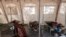 FILE - Patients suffering from cholera receive treatment inside a tent converted into a temporary field hospital near the remote village of Dor, Sudan, April 28, 2017.