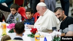 Pope Francis participates in a lunch offered by the Vatican to the poor people, on World Day of Poor at the Vatican, Nov. 13, 2022. 