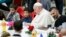 Pope Francis participates in a lunch offered by the Vatican to the poor people, on World Day of Poor at the Vatican, Nov. 13, 2022. 