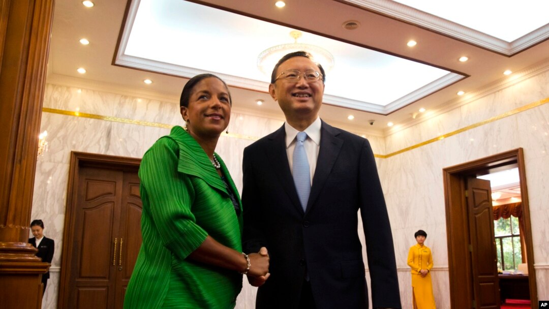 FILE - U.S. National Security Advisor Susan Rice, left, shakes hands with Chinese State Councilor Yang Jiechi at the Diaoyutai State Guesthouse in Beijing, China, Aug. 28, 2015.