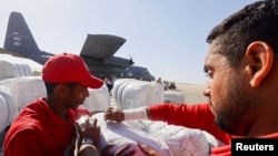 Egyptian Red Crescent members coordinate aid for Gaza after United Nations Secretary-General Antonio Guterres visited the Rafah border crossing between Egypt and the Gaza Strip, at Al Arish Airport, Egypt, on Oct. 20, 2023.