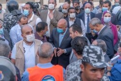 Egyptian Minister of Transportation Kamel El-Wazir (C) and several parliamentarians arrived at the scene a few hours after the crash in Qalyubia province, Egypt, April 18, 2021. (Hamada Elrasam/VOA)