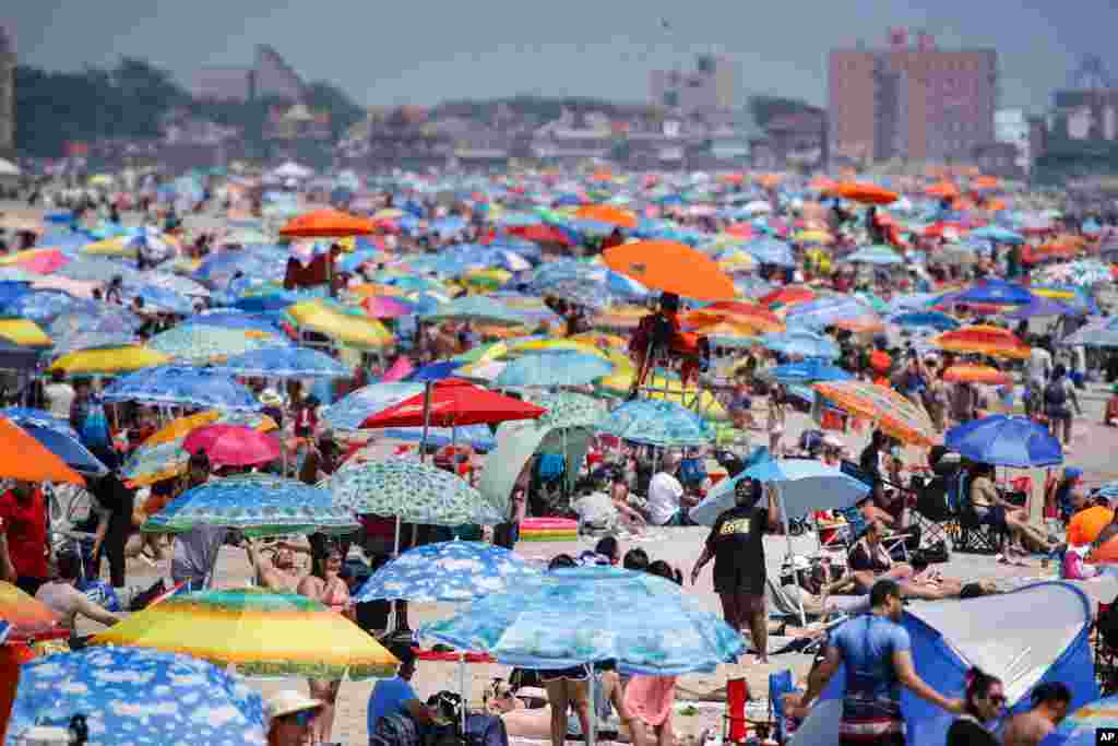 People enjoy the beach at Coney Island, July 4, 2020, in the Brooklyn borough of New York.