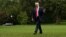 U.S. President Donald Trump walks across the South Lawn after arriving via Marine One helicopter at the White House in Washington, Aug. 14, 2017. 