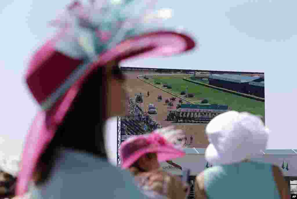 Fans watch a race before the 141th running of the Kentucky Oaks horse race at Churchill Downs in Louisville, Kentucky.&nbsp; The famed Kentucky Derby race runs on Saturday.