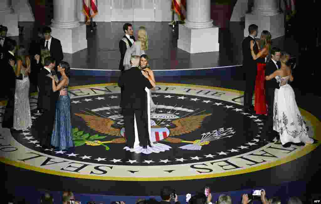 President Donald Trump and First Lady Melania Trump, Vice President J.D. Vance and his wife Usha Vance, Ivanka Trump and her husband Jared Kushner, Eric Trump and his wife Lara Trump, Donald Trump Jr. and his daughter Kai Madison Trump, Barron Trump and his cousin, dance during the Starlight inaugural ball at the Walter E. Washington Convention Center in Washington, Jan. 20, 2025.