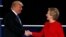 Republican U.S. presidential nominee Donald Trump and Democratic U.S. presidential nominee Hillary Clinton shake hands at the end of their first presidential debate at Hofstra University in Hempstead, New York, U.S., September 26, 2016. 