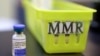 FILE - A vial of a measles, mumps and rubella vaccine sits on a countertop at a pediatrics clinic in Greenbrae, Calif., on Feb. 6, 2015. 