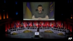 Ukraine's President Volodymyr Zelenskyy addresses, via videolink, the opening ceremony of the Council of Europe summit in Reykjavik, Iceland, on May 16, 2023. (Alastair Grant/AP)