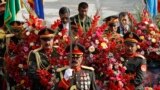 Afghan guards of honor carry wreaths during a ceremony commemorating the 12th anniversary of Ahmad Shah Massoud&#39;s death in Kabul. 