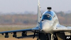 FILE - A Serbian Army MiG-29 jet fighter prepares for flight at the military airport Batajnica near Belgrade, Serbia, Oct. 17, 2017. 