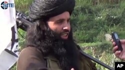 FILE - This undated image provided the SITE Intel Group, an American private terrorist threat analysis company, shows Mullah Fazlullah in Pakistan. 