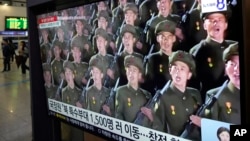 A TV screen shows file images of North Korean soldiers during a news program at Seoul Railway Station in Seoul, South Korea, Oct. 18, 2024. 