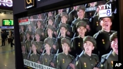 FILE - A TV screen shows file images of North Korean soldiers during a news program at Seoul Railway Station in Seoul, South Korea, Oct. 18, 2024. 