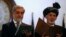 Afghanistan's new President Ashraf Ghani, right, and Afghanistan's Chief Executive Abdullah Abdullah take the oath during their inauguration in Kabul, Sept. 29, 2014. 