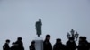 FILE PHOTO: Police officers gather next to a monument to Russian poet Alexander Pushkin as supporters of Russian opposition leader Alexei Navalny are expected to protest against his arrest in Moscow, Russia January 23, 2021. REUTERS/Maxim Shemetov/File Photo