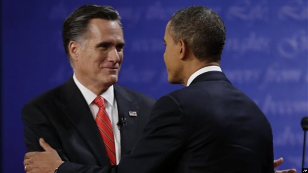 Republican presidential nominee Mitt Romney (L) shakes hands with President Barack Obama following the first presidential debate at the University of Denver, October 3, 2012, in Denver.