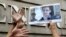 A supporter holds a picture of Edward Snowden, a former CIA employee who leaked top secret information about U.S. surveillance programs, outside the U.S. Consulate General in Hong Kong, June 13, 2013. 