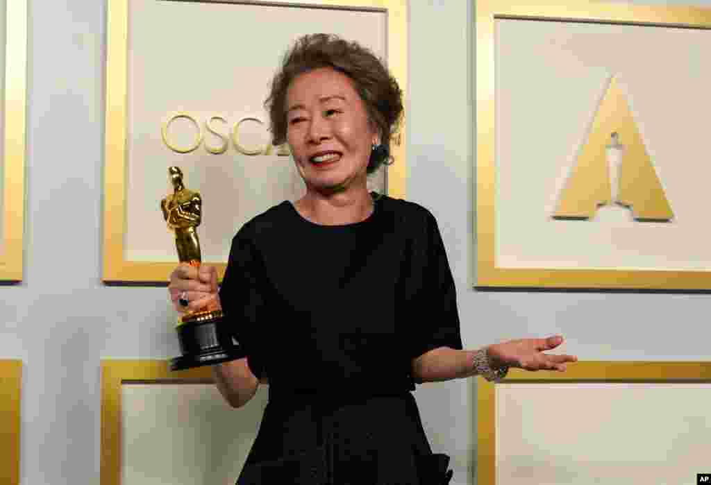 Yuh-Jung Youn, winner of the award for best actress in a supporting role for &quot;Minari,&quot; poses in the press room at the Oscars on Sunday, April 25, 2021, at Union Station in Los Angeles. (AP Photo/Chris Pizzello, Pool)