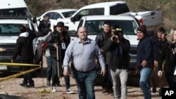 Julian Le Baron arrives where one of the cars belonging to the extended LeBaron family was ambushed by gunmen last year near Bavispe, Sonora state, Mexico, Sunday Jan. 12, 2020.