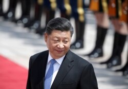 FILE PHOTO: Chinese President Xi Jinping attends a welcoming ceremony for Greek President Prokopis Pavlopoulos in Beijing