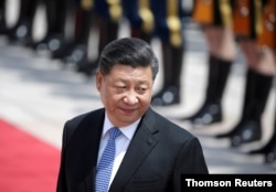 FILE PHOTO: Chinese President Xi Jinping attends a welcoming ceremony for Greek President Prokopis Pavlopoulos in Beijing