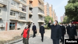 Çin Devlet Başkan Xi Jinping salgının ilk ortaya çıktığı Wuhan kentini ziyaret etti