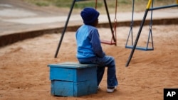 FILE - A child sits outside Nyumbani Children's Home in Nairobi, Kenya, Aug. 15, 2023. The orphanage cares for over 100 children with HIV, providing them with PEPFAR-supplied antiretroviral drugs. Funds for PEPFAR were among those included in a U.S. aid freeze, Jan. 24, 2025.